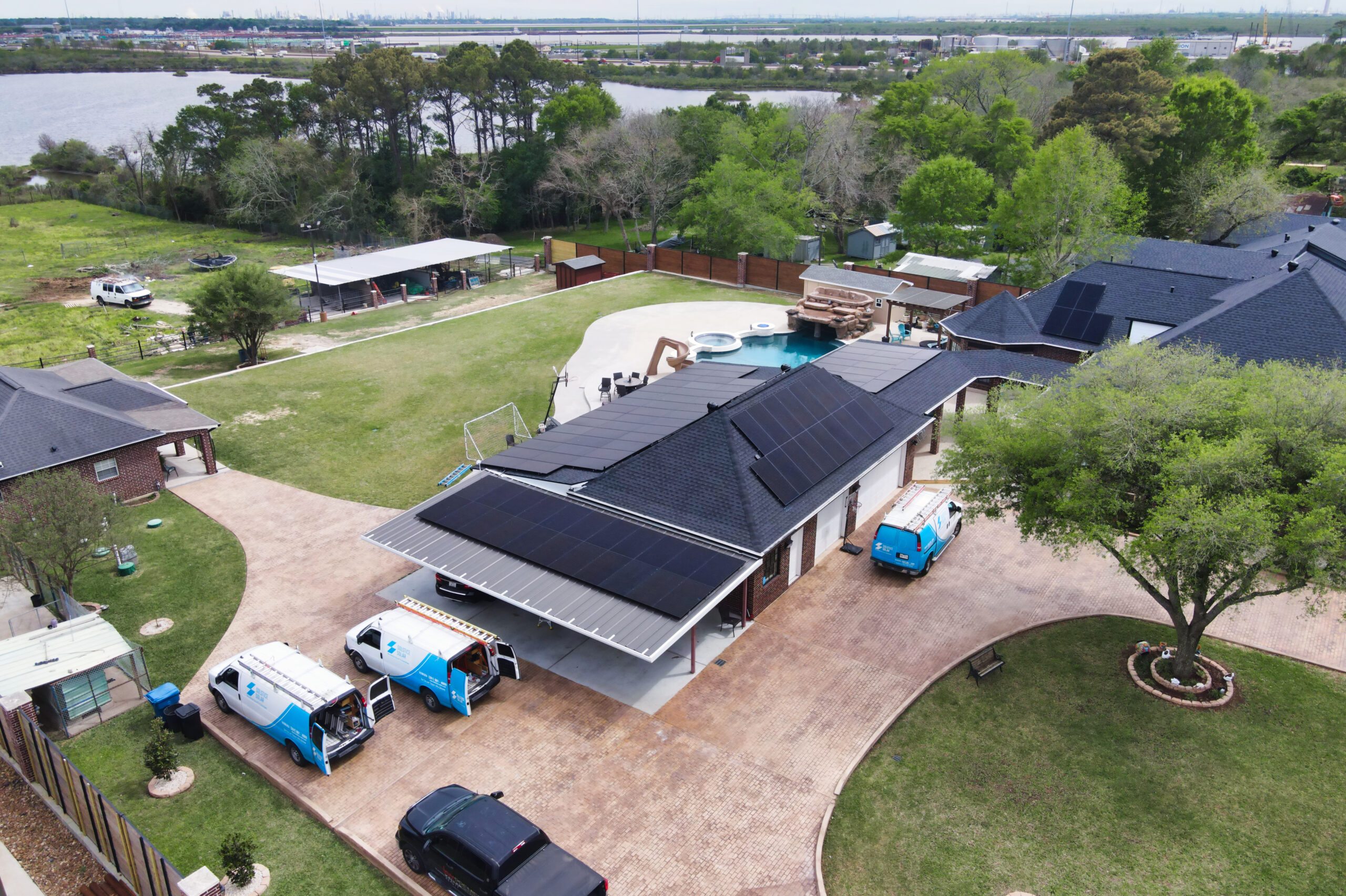 Large solar installation on the roof of a house in Houston, Texas, with panels gleaming under the sunlight.