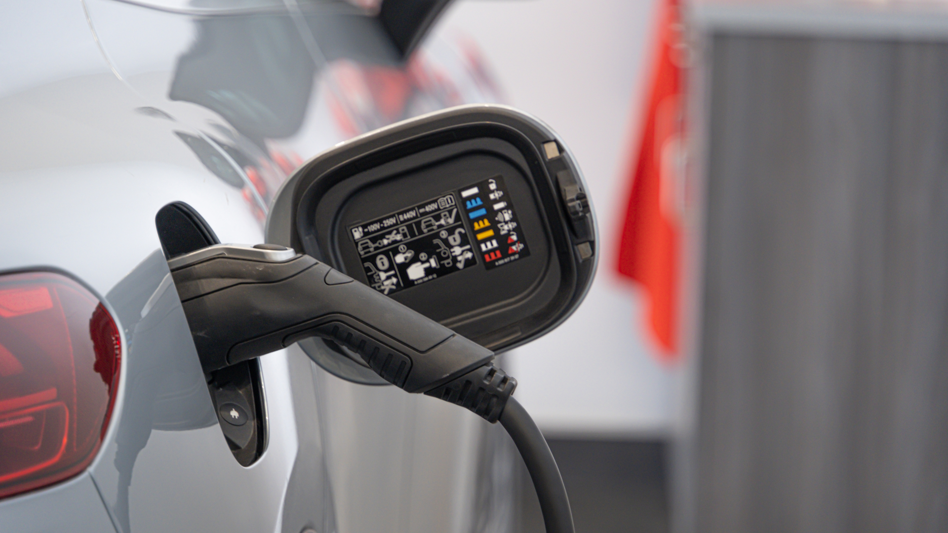 An electrical vehicle being charged by an EV Charger connected to solar PV panels
