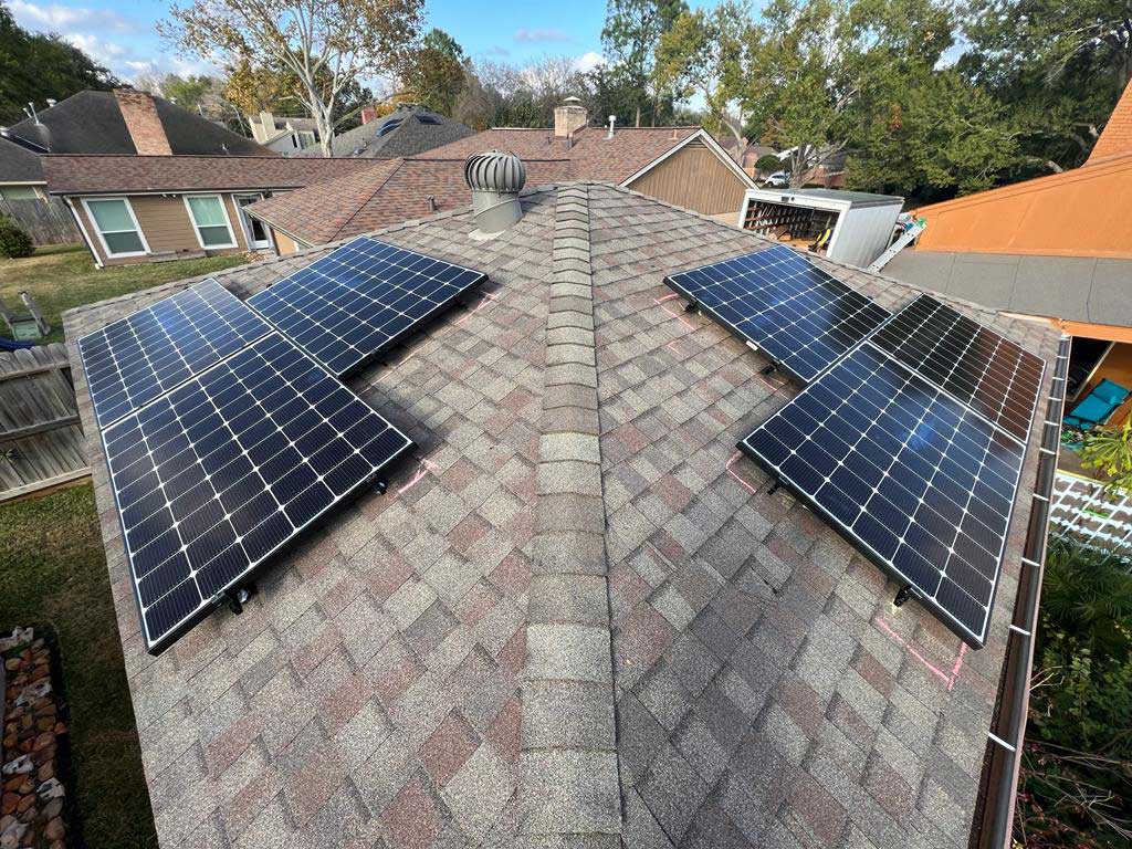 Roof covered with solar panels on all sides, maximizing energy generation.