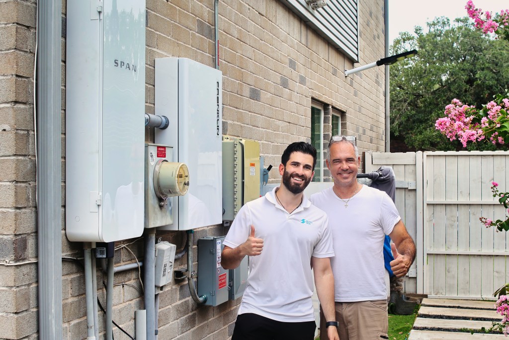 Solstice Solar installers setting up a SPAN panel and solar battery system from FranklinWH.