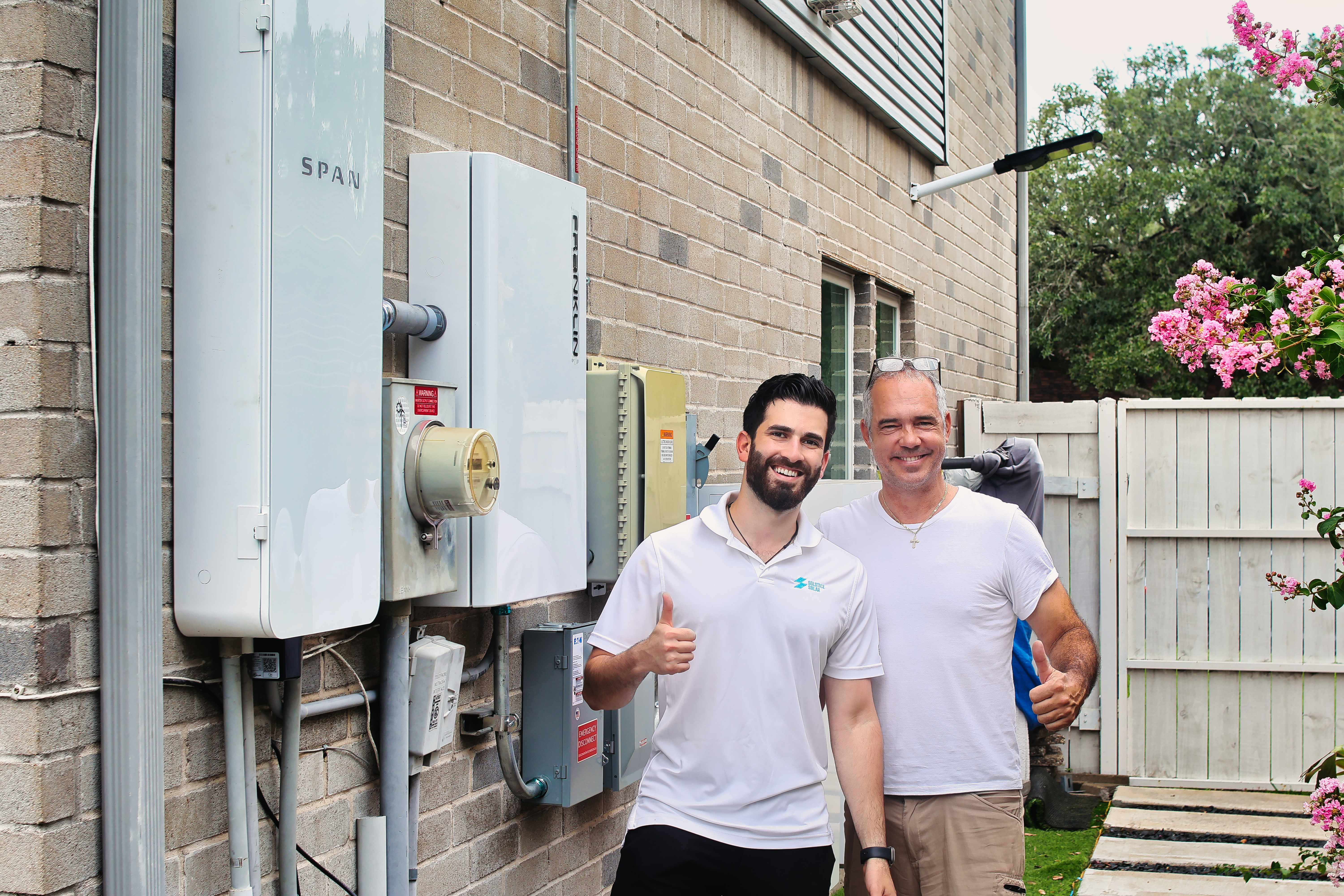 Solstice Solar installers setting up a SPAN panel and solar battery system from FranklinWH.