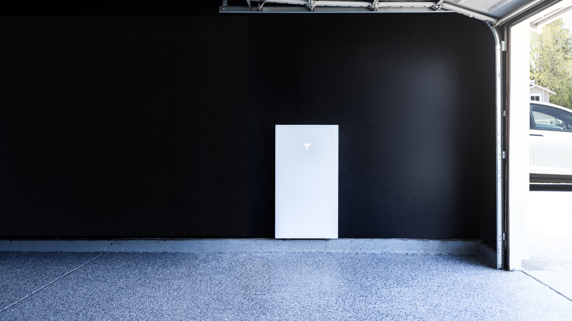 Tesla Powerwall installed on a wall, providing energy storage.