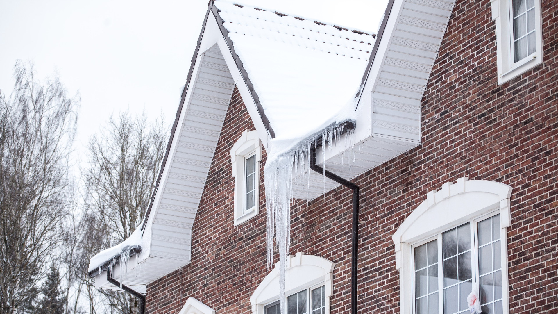 House covered in a light layer of winter snow.