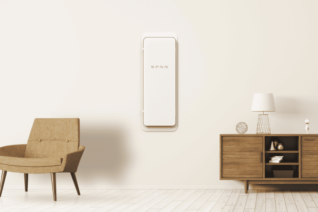 A modern smart electrical panel, like the Span Panel, mounted on the wall.