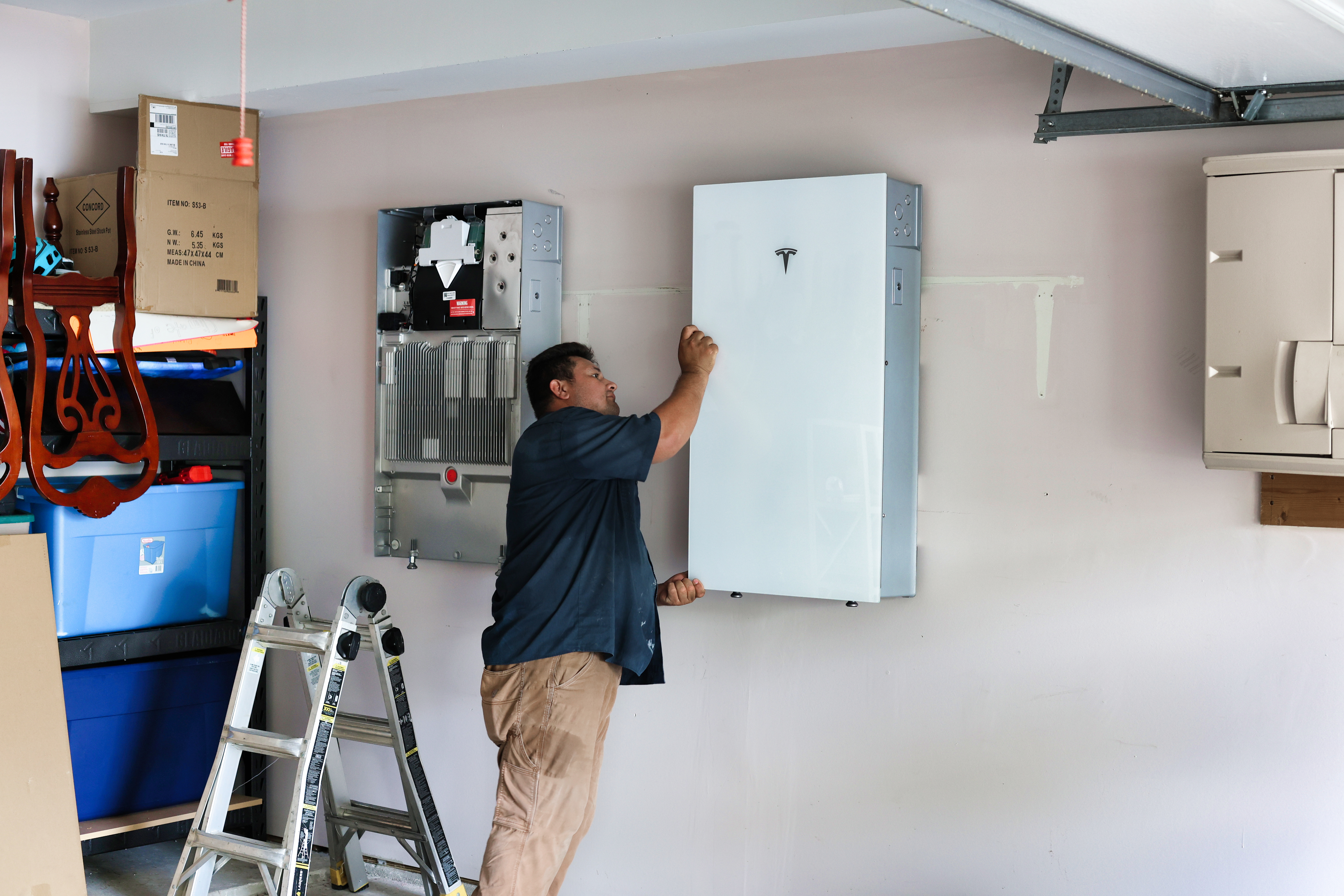 Solstice Solar installers installing Tesla Powerwall in Houston, Texas.